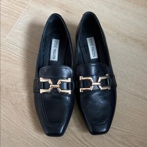 Steve Madden Black Slip-Ons with Gold Detail